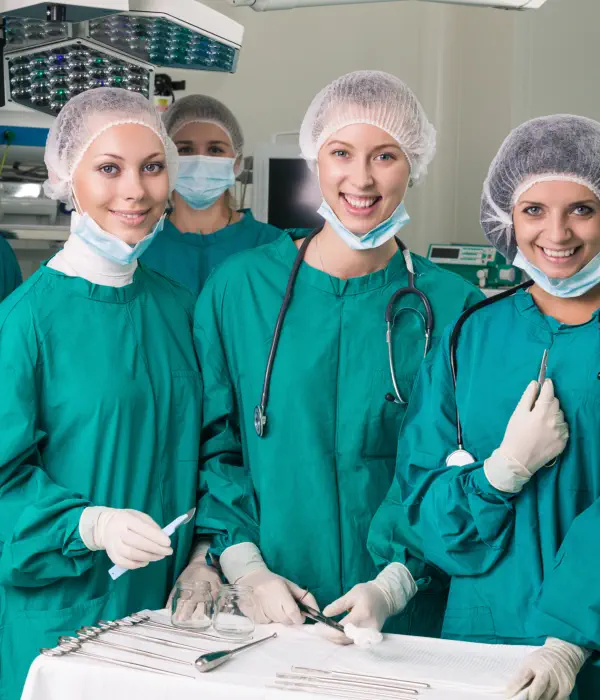 three healthcare professionals smiling together