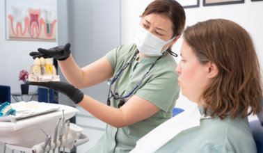 doctor showing results of dental checkup