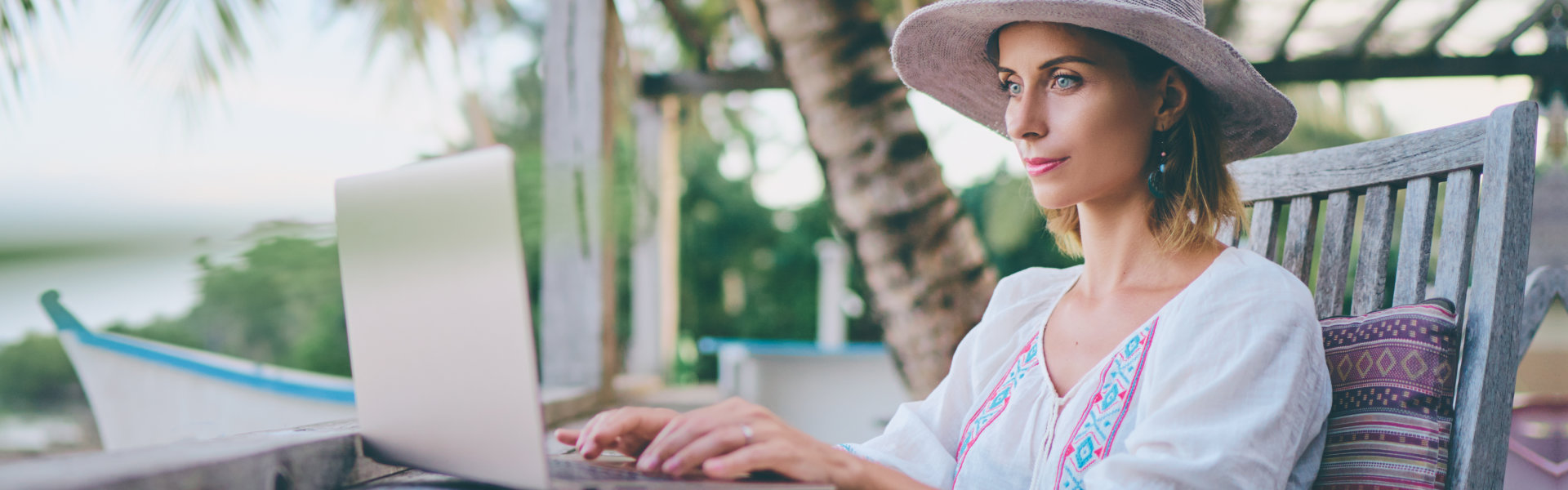 a female tourist typing in her laptop